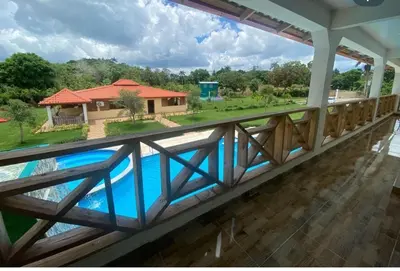 a view from the balcony of a house with a swimming pool at Villa las Rosas JP in Bayaguana
