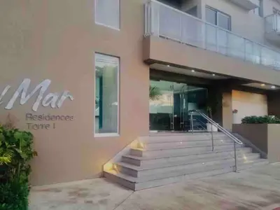 a building with a sign that reads mars reference home i at Hermoso Apartamento cerca de la playa, Restaurantes, Supermercados, Restaurantes, Aeropuertos, parqueo gratis in Boca Chica