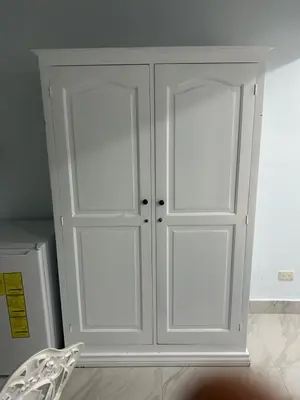a white cabinet with two doors in a room at Hotel Hannabi in Boca Chica