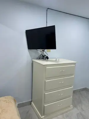 a dresser with a tv on top of it at Hotel Hannabi in Boca Chica