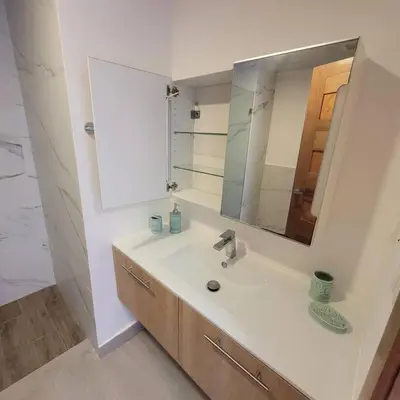 a bathroom with a sink and a mirror at Vibe Residence Hotelstyle NO KITCHEN STUDIO close to beach in La Laguna