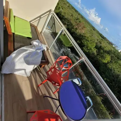 a balcony with a table and chairs on a deck at Vibe Residence Hotelstyle NO KITCHEN STUDIO close to beach in La Laguna