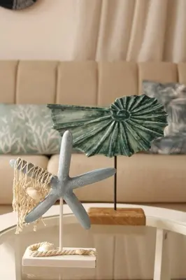 a living room with a table with a starfish and a table sidx sidx sidx at Albatros by R&R 2 in Villas del Mar