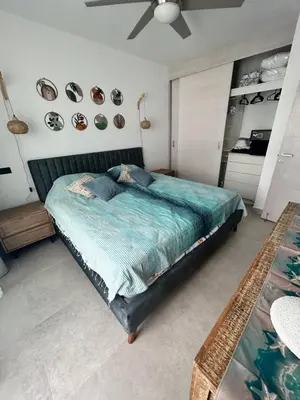 a bedroom with a bed and a ceiling fan at Słoneczny apartament AC WiFi in La Laguna