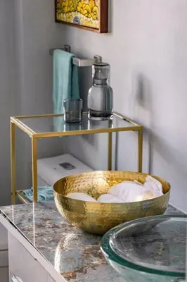 a bowl on top of a counter with a shelf at Renovated Condo at the Beach Close to Everything in Las Terrenas