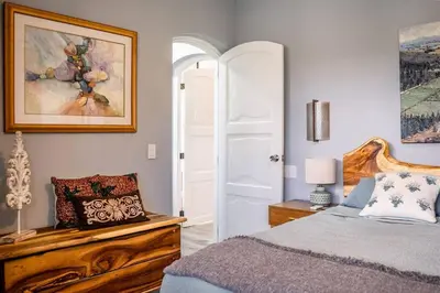 a bedroom with a bed and a picture on the wall at Renovated Condo at the Beach Close to Everything in Las Terrenas