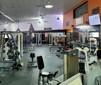 a gym with a lot of equipment and people in it at Gorgeous 2 bedroom apartment in Vibe Residence in Bayahibe