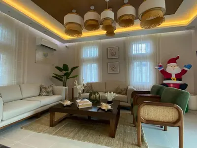 a living room with a santa claus figure on the ceiling at Sun on the bay beach hotel in Palmar de Ocoa