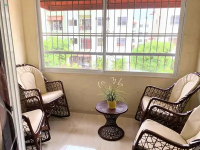 a room with chairs and a table and a window at Apartamento de Relajacion in Los Paredones