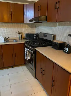 a kitchen with a stove and a sink at Confortable Apto de relajación in Los Paredones