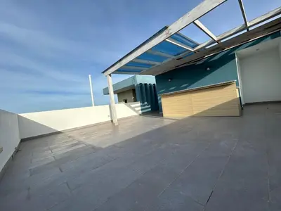 an empty balcony of a building with a roof at Samana Complexes Los Robles VII in Los Paredones