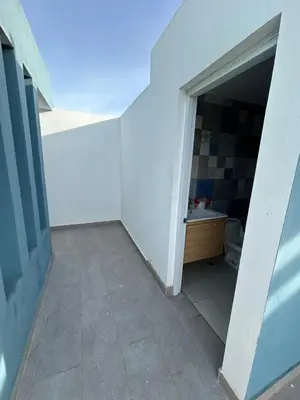 an empty hallway with a bathroom with a sink at Samana Complexes Los Robles VII in Los Paredones