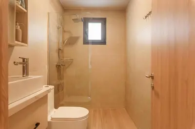 a bathroom with a shower and a toilet and a sink at Sausalito | Relax Vista Piscina in Punta Cana