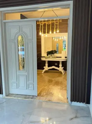 a doorway to a room with a table and a mirror at VILLA EN CASA DE CAMPO, La Romana, Rep Dom in La Romana