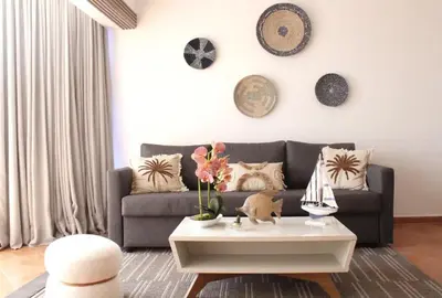a living room with a couch and a coffee table at Albatros by R&R in Villas del Mar