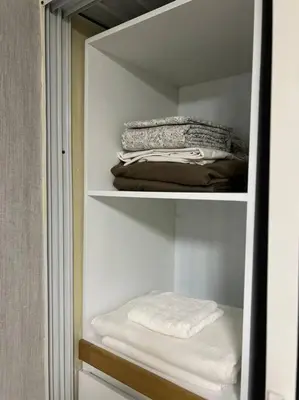 a closet with some folded towels in it at Apartamento Lujoso En San Pedro de Macoris in San Pedro de Macorís