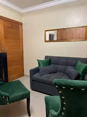 a living room with a couch and two chairs at Apartamento Lujoso En San Pedro de Macoris in San Pedro de Macorís