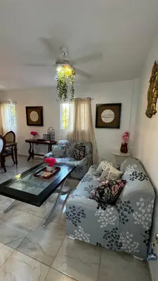 a living room with a couch and a table at Céntrico con wifi, luz,gas, TV y aire incluido in La Romana