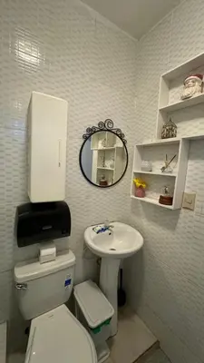 a small bathroom with a toilet and a sink at Céntrico con wifi, luz,gas, TV y aire incluido in La Romana