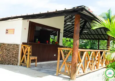 a small house with a porch and a deck at Colina Buena Vista A5 in Jarabacoa
