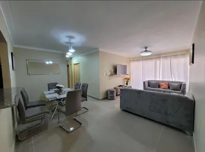 a living room with a couch and a table at Apartamento Amaya in Licey