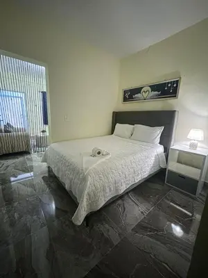 a bedroom with a bed with a towel on it at New hotel neo in Santa Cruz de Barahona