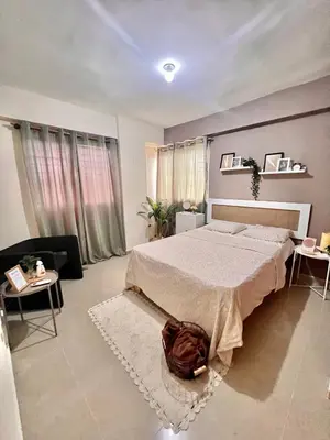 a bedroom with a large bed and a couch at Condominio Emilia in Cancino