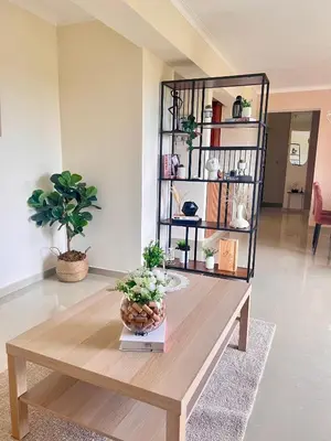 a coffee table in a living room with plants on it at Condominio Emilia in Cancino