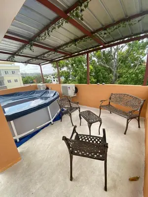 a patio with three benches and a swimming pool at Hogar lejos de casa, piscina in San Cristóbal