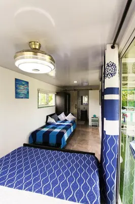 a bedroom with two beds in a room at BlueEcolandia Bungalow AGUA in Jarabacoa