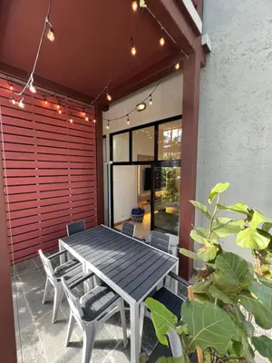 a table and chairs on the patio of a house at Aqua Loft 120 in La Puntica de Juan Dolio