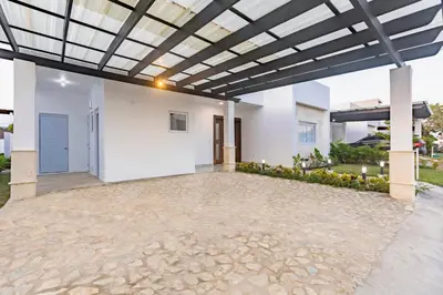 a large patio with awning in a house at Villa Ruby Bella in Sosúa