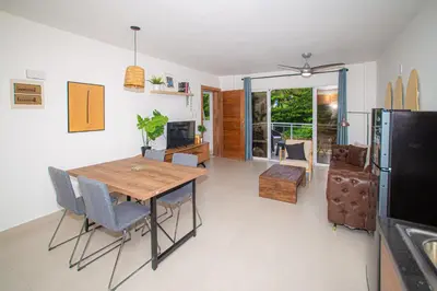 a kitchen and dining room with a table and chairs at CMB202 BEACH AREA Res Cristamar in Eslabón
