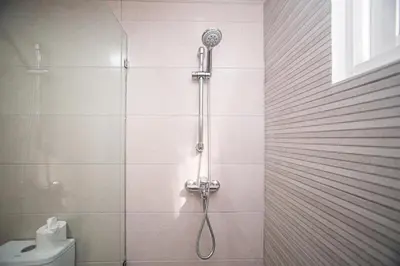 a shower with a shower head in a bathroom at CMB202 BEACH AREA Res Cristamar in Eslabón