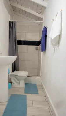 a bathroom with a toilet and a sink at Casa Ballenas3 SF in Las Terrenas