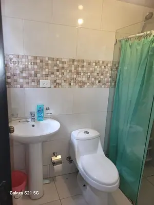 a bathroom with a toilet and a sink and a shower at Solo para dos in La Romana