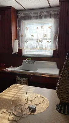 a bathroom with a bath tub and a sink at Rancho silvestre in Monte Plata