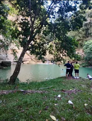 a group of people standing in front of a river at Rancho silvestre in Monte Plata