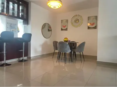 a dining room with a table and chairs at Santuario Tropical at Marino Paradise in La Puntica de Juan Dolio