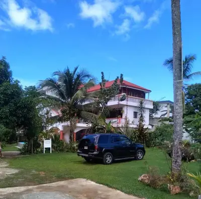 a black van parked in front of a house at Casa Mariana in Las Terrenas