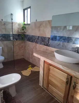 a bathroom with a sink and a toilet at Casa Mariana in Las Terrenas