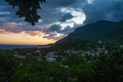a view of a town in the mountains at sunset at Hotel-Restaurante Snack Cana in La Ciénaga