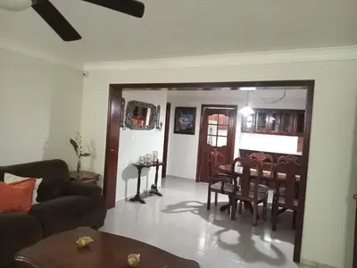 a living room with a couch and a table at Apartamento en Arroyo Hondo viejo in Santo Domingo