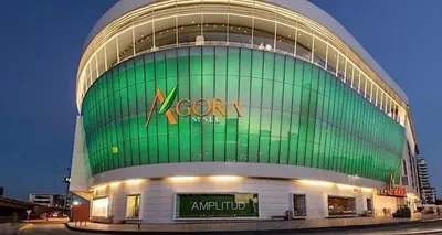 a large green building with a sign on it at Apartamento en Arroyo Hondo viejo in Santo Domingo