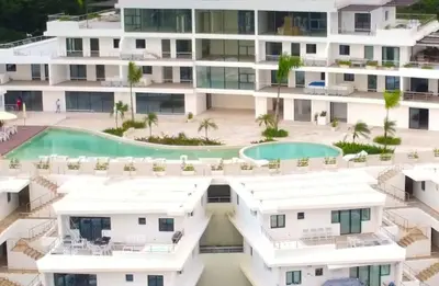 an aerial view of a building with a swimming pool at Las Terrenas Paradise in Las Terrenas