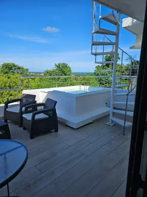 a hot tub on the deck of a house at Las Terrenas Paradise in Las Terrenas