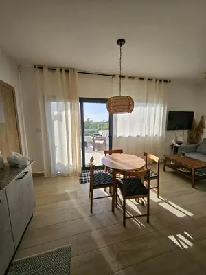 a kitchen and dining room with a table and chairs at Las Terrenas Paradise in Las Terrenas