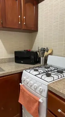 a white stove top oven in a kitchen at Apartamento en Proyecto Frente al Mar en Sosua in Los Altos de Jalisco