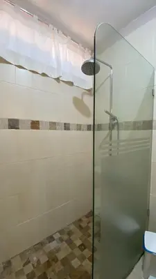 a shower with a glass door in a bathroom at Apartamento en Proyecto Frente al Mar en Sosua in Los Altos de Jalisco