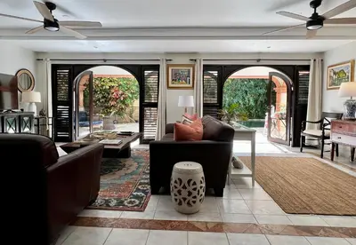 a living room with a couch and a table at Villa Marina in Sosúa